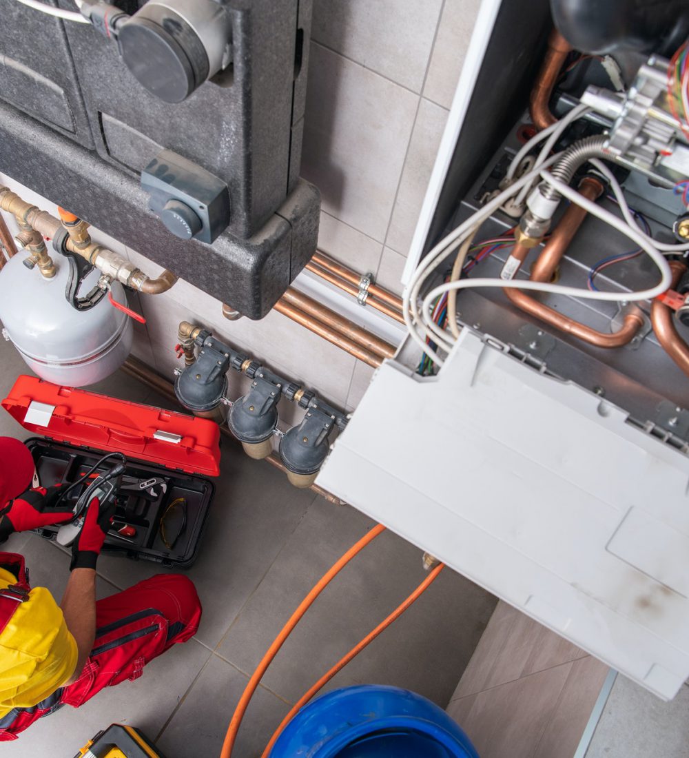 Residential Heating Systems Technician Performing Maintenance